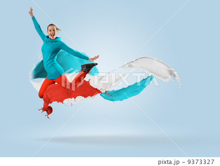 young female dancer jumping with splash of paint 9373327