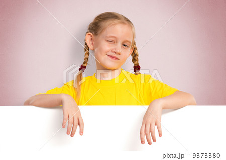 girl holding a white banner girl holding a white banner 9373380