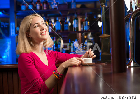 woman with a cup of coffee woman with a cup of coffee 9373882