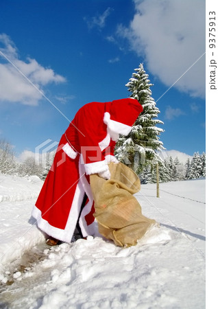 Santa Claus is looking in his bag 9375913