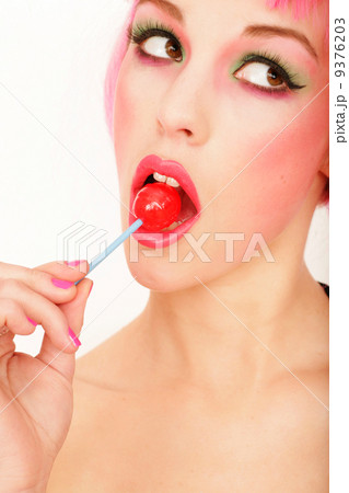 beautiful woman licking lollipop 9376203