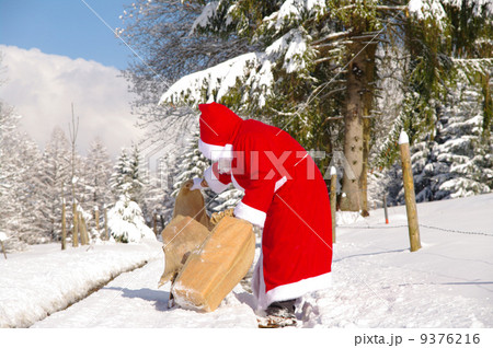 Santa Claus is looking in his bag Santa Claus is looking in his bag 9376216