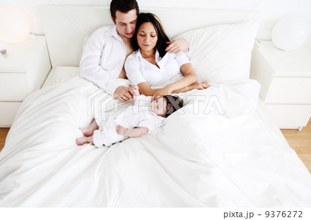 Family in white bed Family in white bed 9376272