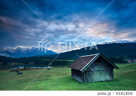 wooden hut by Geroldsee lake during sunrise 9381808