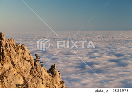 Evening rocks and sea in clouds 9381973