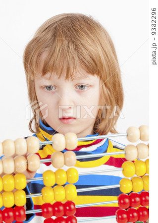 Child Counting on Colorful Wooden Abacus Child Counting on Colorful Wooden Abacus 9382296