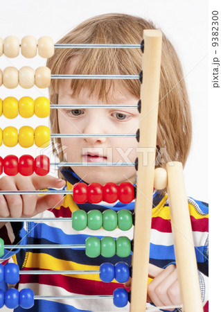 Child Counting on Colorful Wooden Abacus 9382300