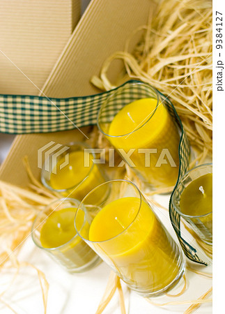 yellow candles, ribbon and box yellow candles, ribbon and box 9384127