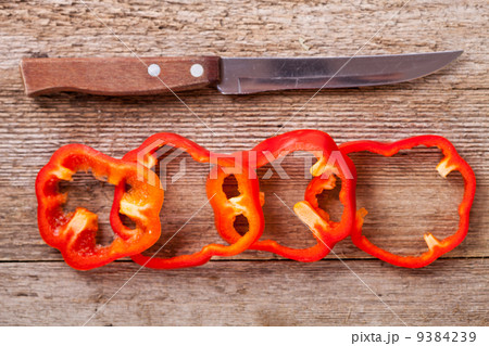 sliced red bell peppers and old knife sliced red bell peppers and old knife 9384239