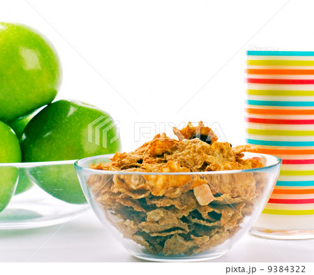 cornflakes, glass of milk and green apples cornflakes, glass of milk and green apples 9384322