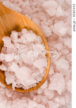 sea salt on a wooden spoon sea salt on a wooden spoon 9385443