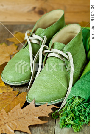 leather boots, scarf and yellow leaves leather boots, scarf and yellow leaves 9387004