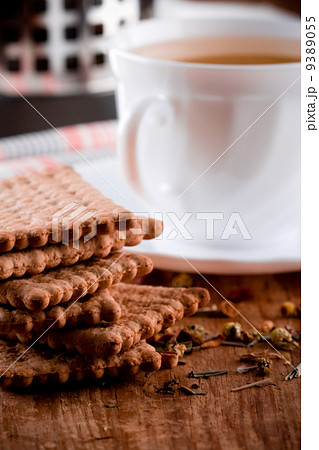 cup of herbal tea and some fresh cookies 9389055