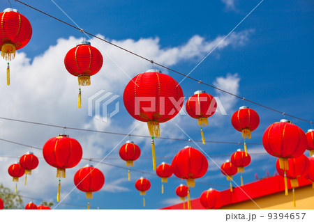 Red Chinese Paper Lanterns against a Blue Sky 9394657