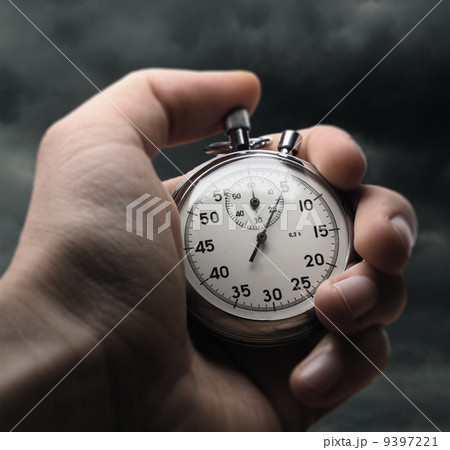 Hand holding stopwatch Hand holding stopwatch 9397221