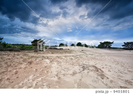 stormy clouds over sand dunes in Drenthe 9403801