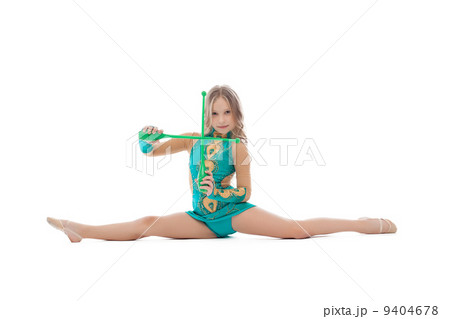 Beautiful artistic gymnast sitting on split 9404678