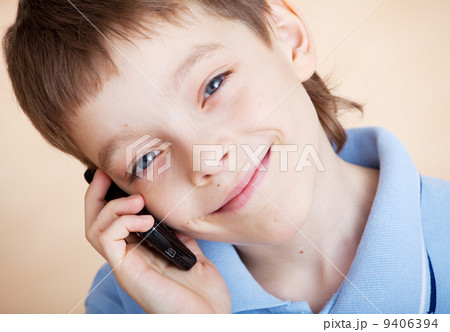 Boy, talking on the phone 9406394