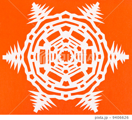 white snowflake on orange paper white snowflake on orange paper 9406626