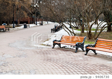 empty wooden benches in city park empty wooden benches in city park 9406730