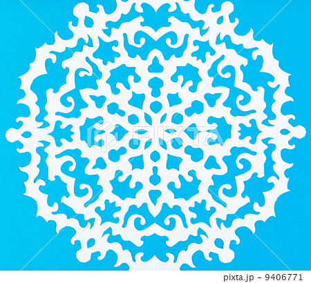 white snowflake on blue paper white snowflake on blue paper 9406771