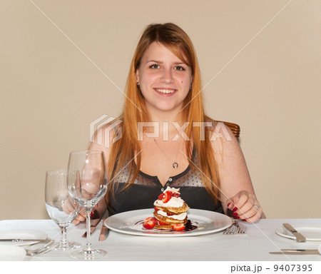 Teen girl eating pancake Teen girl eating pancake 9407395