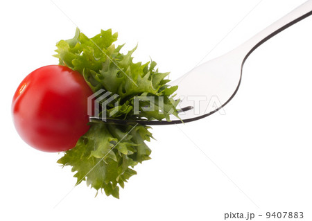 Fresh salad and cherry tomato on fork isolated on white backgrou Fresh salad and cherry tomato on fork isolated on white backgrou 9407883