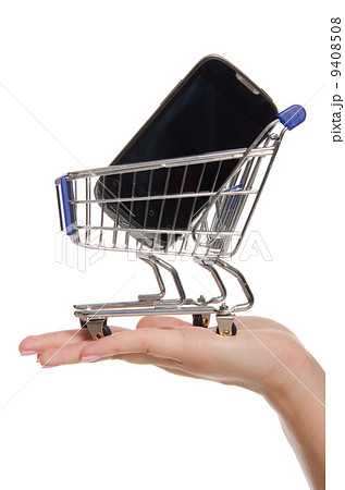 smartphone in shopping trolley on the palm 9408508