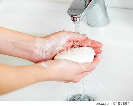 Washing of hands with soap in bathroom close up 9409894