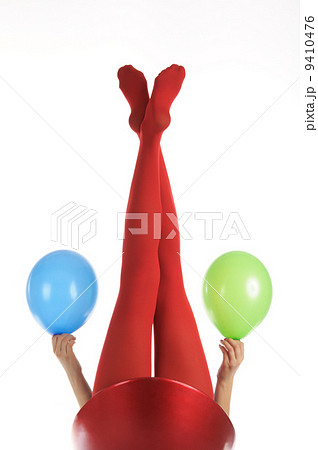 Female feet in red stockings with balloons Female feet in red stockings with balloons 9410476