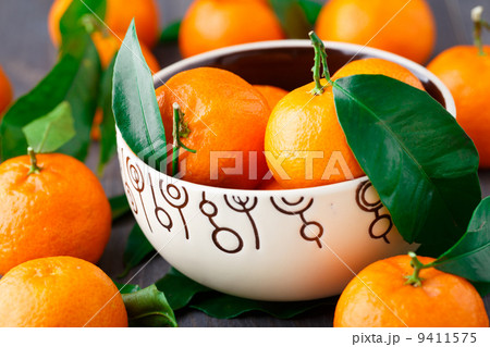 Tangerines on wooden background Tangerines on wooden background 9411575