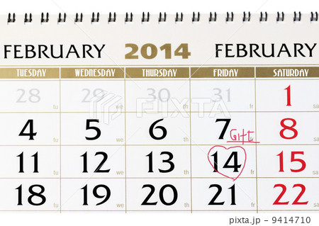 Calendar page with red heart on February 14 2014. 9414710