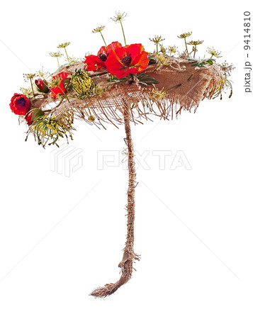 Decorative umbrella from burlap, mats and artificial poppy flowe 9414810