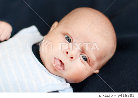 Adorable baby boy with blue eyes Adorable baby boy with blue eyes 9416883