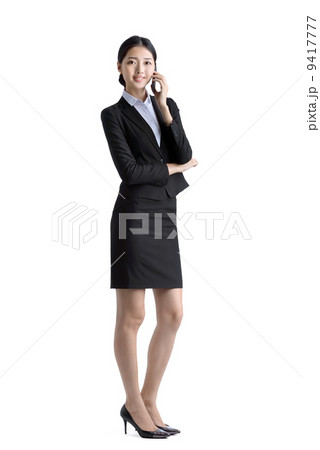Business woman using mobile phone studio white background 9417777