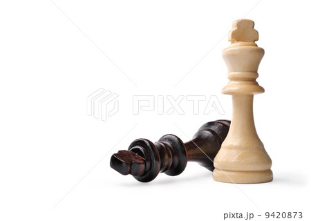 Two wooden king chess pieces on white Two wooden king chess pieces on white 9420873