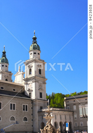 Famous cathedral and Residenzbrunnen fountain on Residenzplats, Famous cathedral and Residenzbrunnen fountain on Residenzplats, 9423608