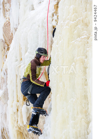 Young man climbing the ice Young man climbing the ice 9424467