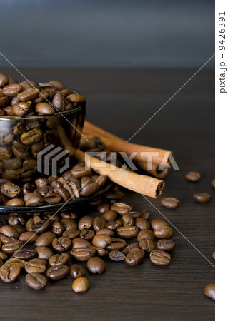 coffee beans, cup, Pots, cinnamon on dark background 9426391