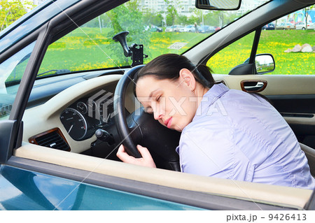 Young girl sleeps in her car. Young girl sleeps in her car. 9426413