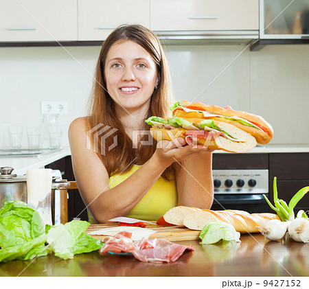 girl with cooked spanish sandwiches 9427152