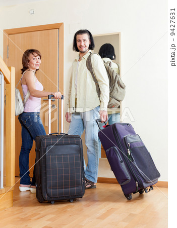 big suitcases at the entrance of the house 9427631