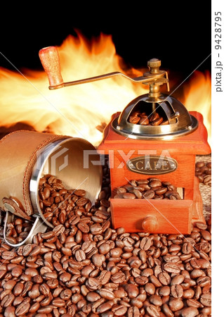 Hot mug of coffee by the fire Hot mug of coffee by the fire 9428795