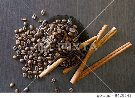 coffee beans, cup, Pots, cinnamon on dark background 9429542