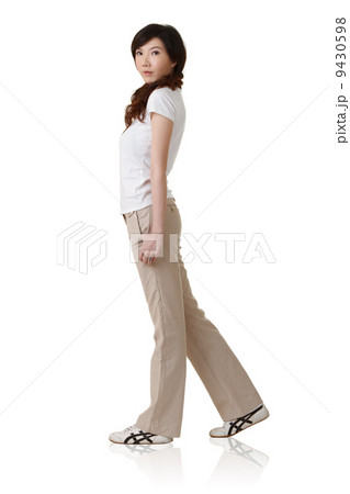 Young Asian lady walking 9430598