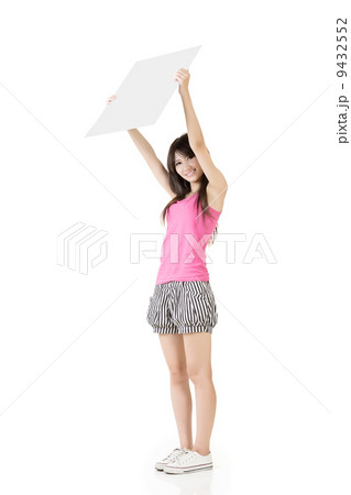 Young pretty woman holding a blank Young pretty woman holding a blank 9432552