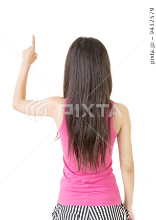 Young pretty asian woman pointing up Young pretty asian woman pointing up 9432579