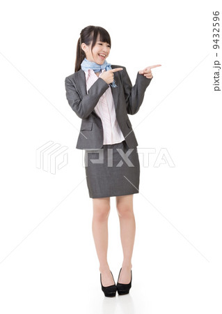 Attractive business woman showing or pointing Attractive business woman showing or pointing 9432596