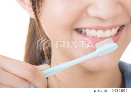 Closeup shot of woman brushing teeth Closeup shot of woman brushing teeth 9432692
