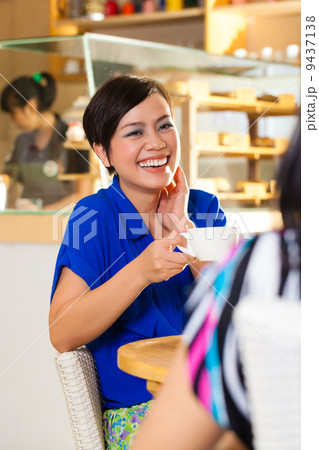 Young women in an Asian coffee shop 9437138